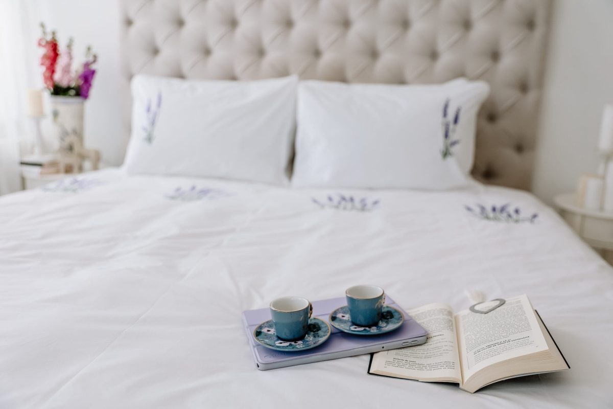 White premium cotton bed sheets with an embroidered flower design