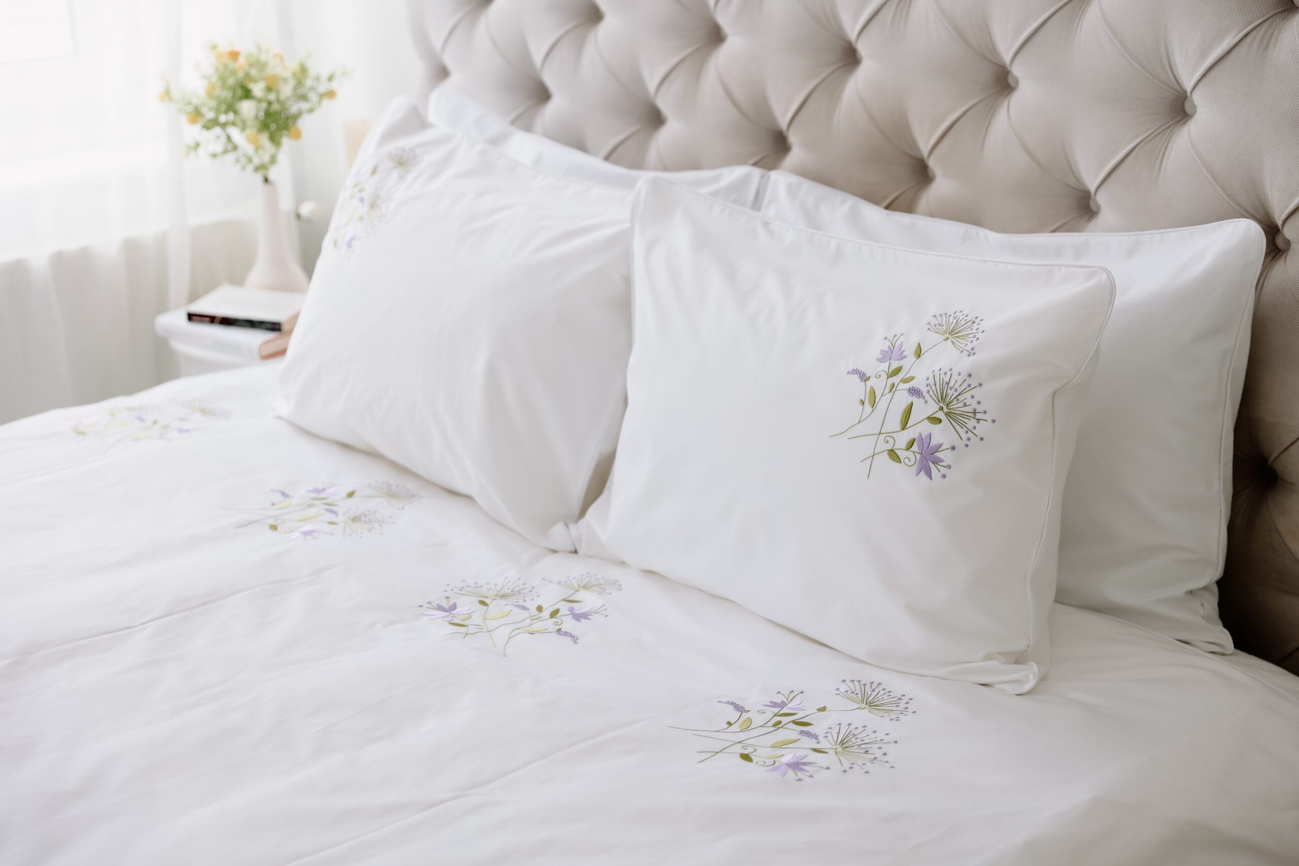white premium cotton pillows with embroided flower design